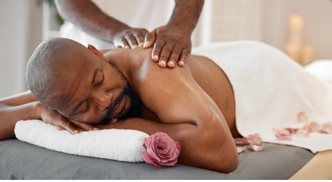 Softly lit couples massage suite with twin beds at Komfort Place Signature Spa, Lekki